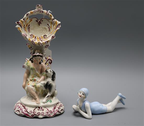 A Staffordshire watch holder and a bathing beauty figurine